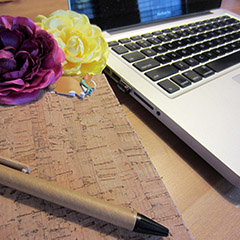 Notebook, a pen and a MacBook